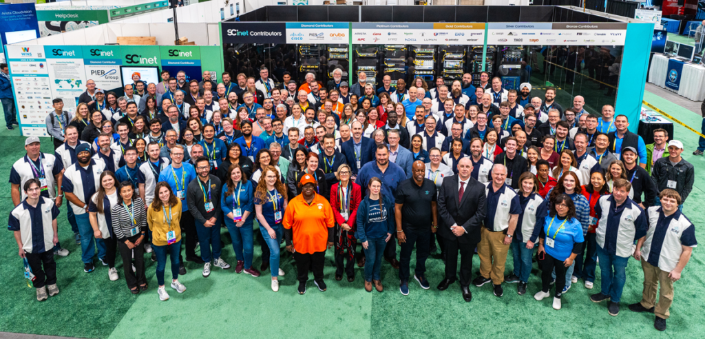 Large group of professionals gathering for a group photo.