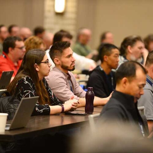 Participants listen to a presentation at an Internet2 conference.