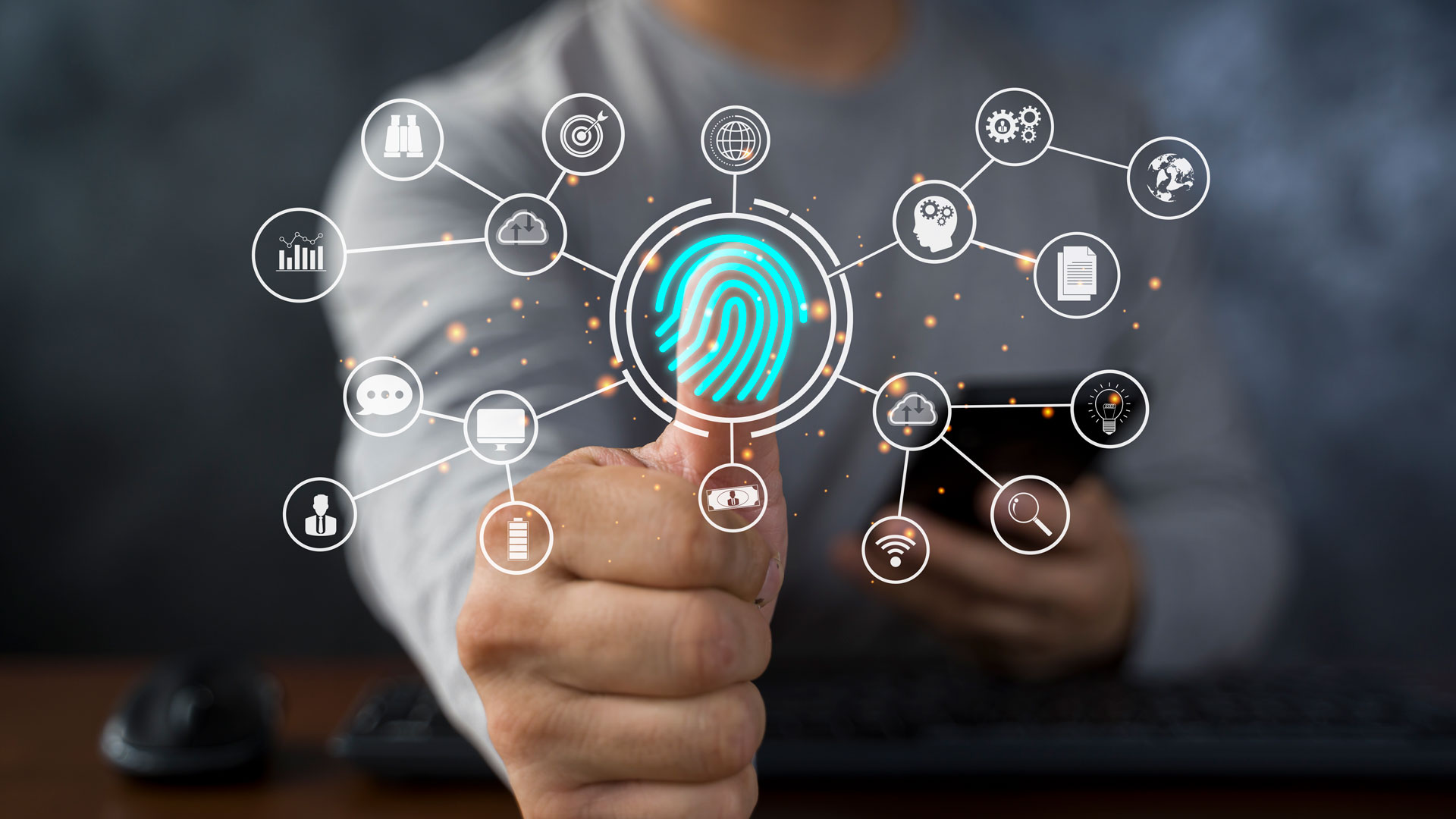 A person’s hand giving a thumbs-up, with a glowing teal fingerprint icon superimposed over the thumb