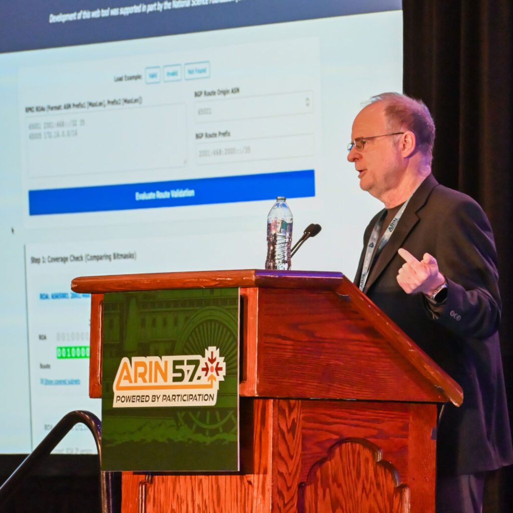 Steven Wallace presenting at Arin 57.