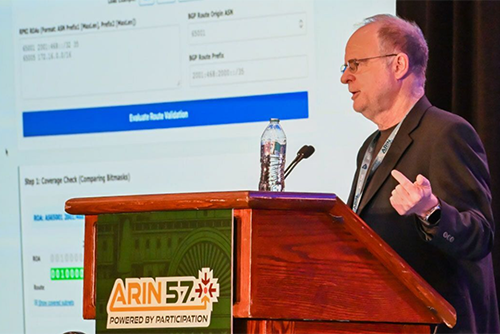 Steve Wallace from Internet2 speaks from a podium.